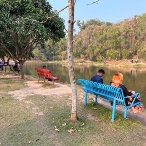 visitors sitting on the benches at cafe 24 park